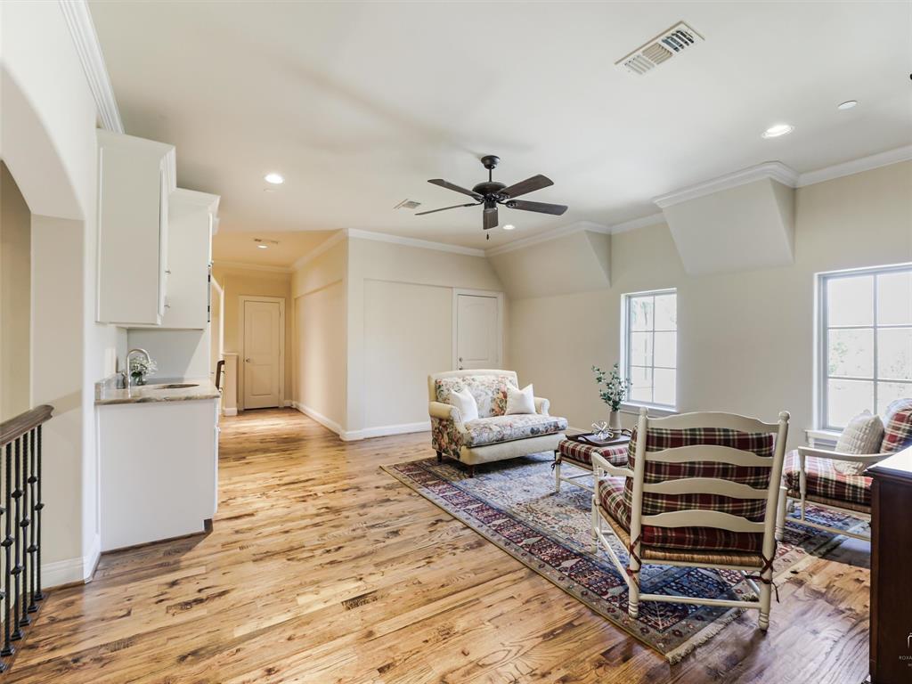 907 Foxglove Trail Fairview, TX 75069 - Photo 23 of 37 a living room with furniture and wooden floor