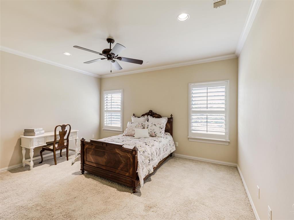 907 Foxglove Trail Fairview, TX 75069 - Photo 28 of 37 a bed room with a bed and a chair