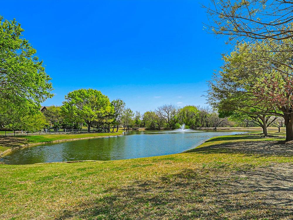 907 Foxglove Trail Fairview, TX 75069 - Photo 36 of 37 a view of a lake with a big yard