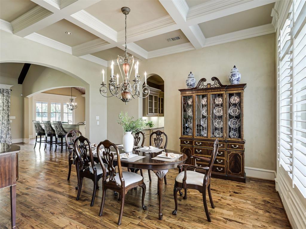 907 Foxglove Trail Fairview, TX 75069 - Photo 7 of 37 a view of a dining room with furniture and chandelier