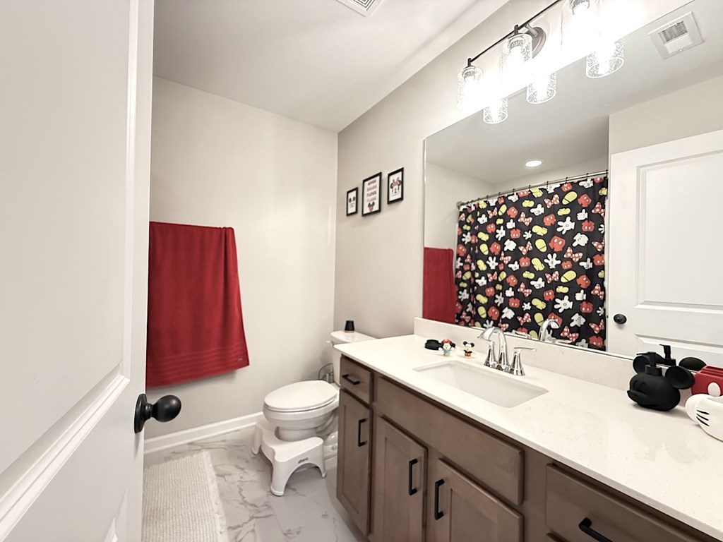 33 Sugar Maple Drive Fort Mitchell, AL 36856 - Photo 23 of 29 a bathroom with a sink a toilet and shower