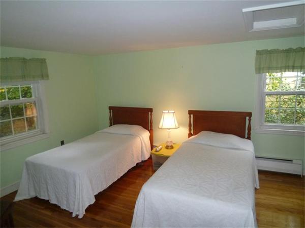 54 Edmund Road Arlington, MA 02474 - Photo 6 of 12 a bedroom with two beds and a window