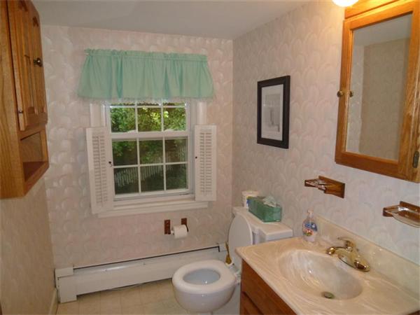 54 Edmund Road Arlington, MA 02474 - Photo 8 of 12 a bathroom with a sink and a toilet