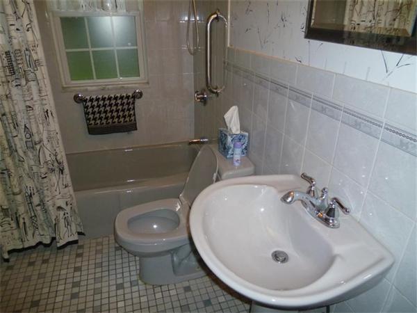 54 Edmund Road Arlington, MA 02474 - Photo 9 of 12 a bathroom with a sink a toilet and shower
