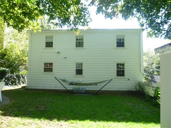 54 Edmund Road Arlington, MA 02474 - Photo 10 of 12 a view of a house with a yard