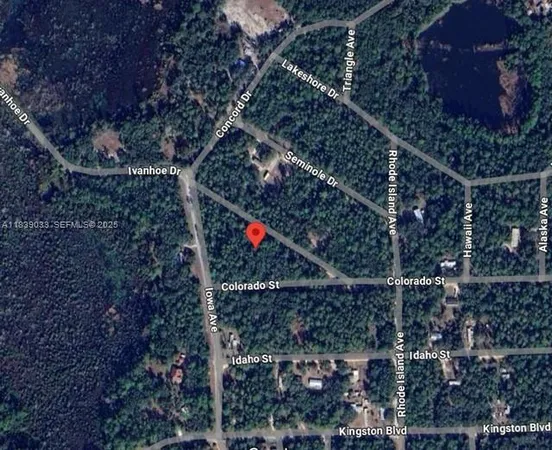 an aerial view of house with yard