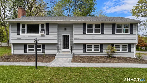 a front view of a house with garage