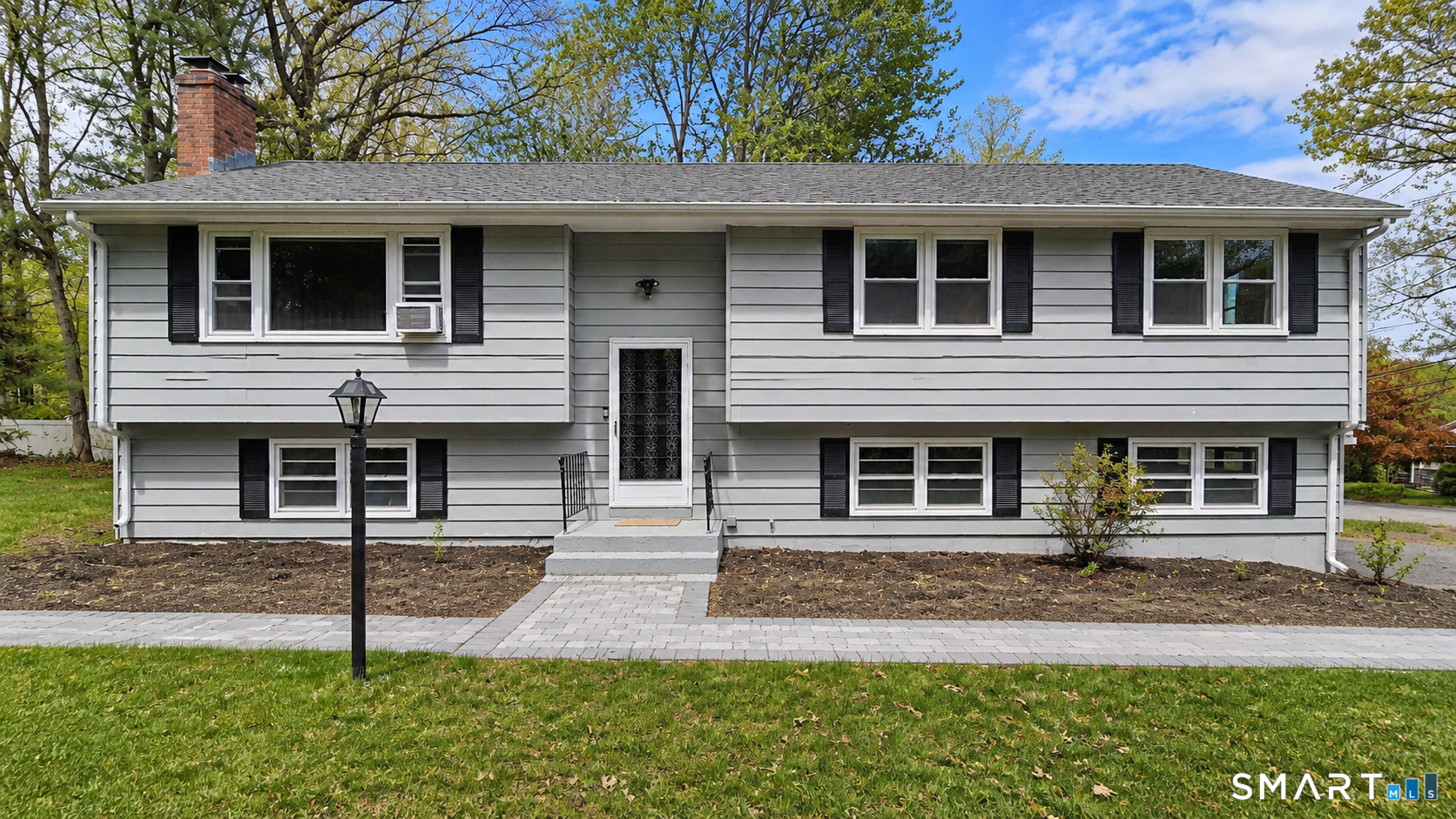 63 Pond Road Windsor, CT 06095 - Photo 1 of 17 a front view of a house with garage