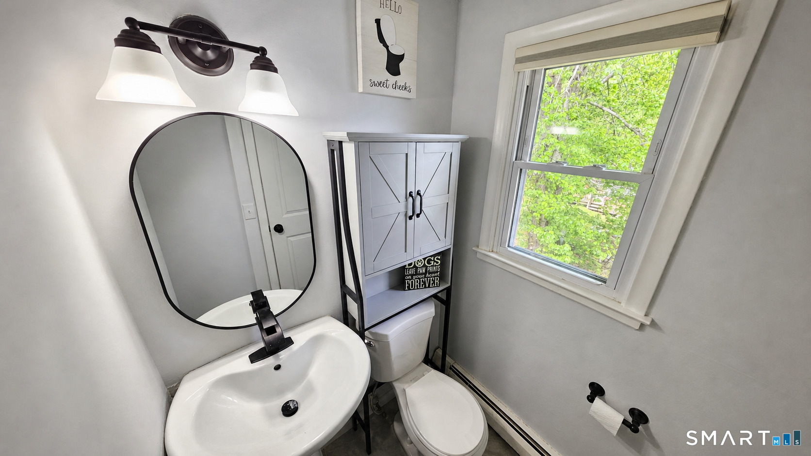 63 Pond Road Windsor, CT 06095 - Photo 11 of 17 a bathroom with a sink mirror and toilet