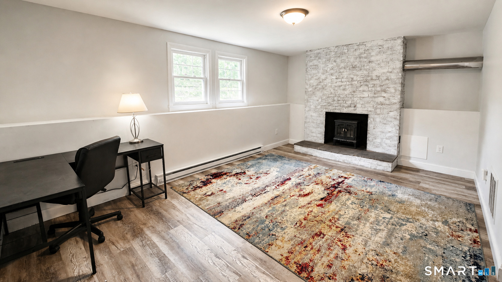 63 Pond Road Windsor, CT 06095 - Photo 15 of 17 a view of a livingroom with a fireplace and a window