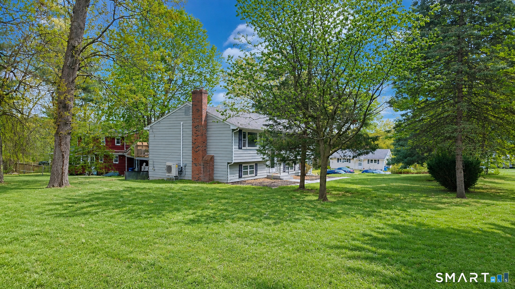 63 Pond Road Windsor, CT 06095 - Photo 17 of 17 a house with a tree in front of it