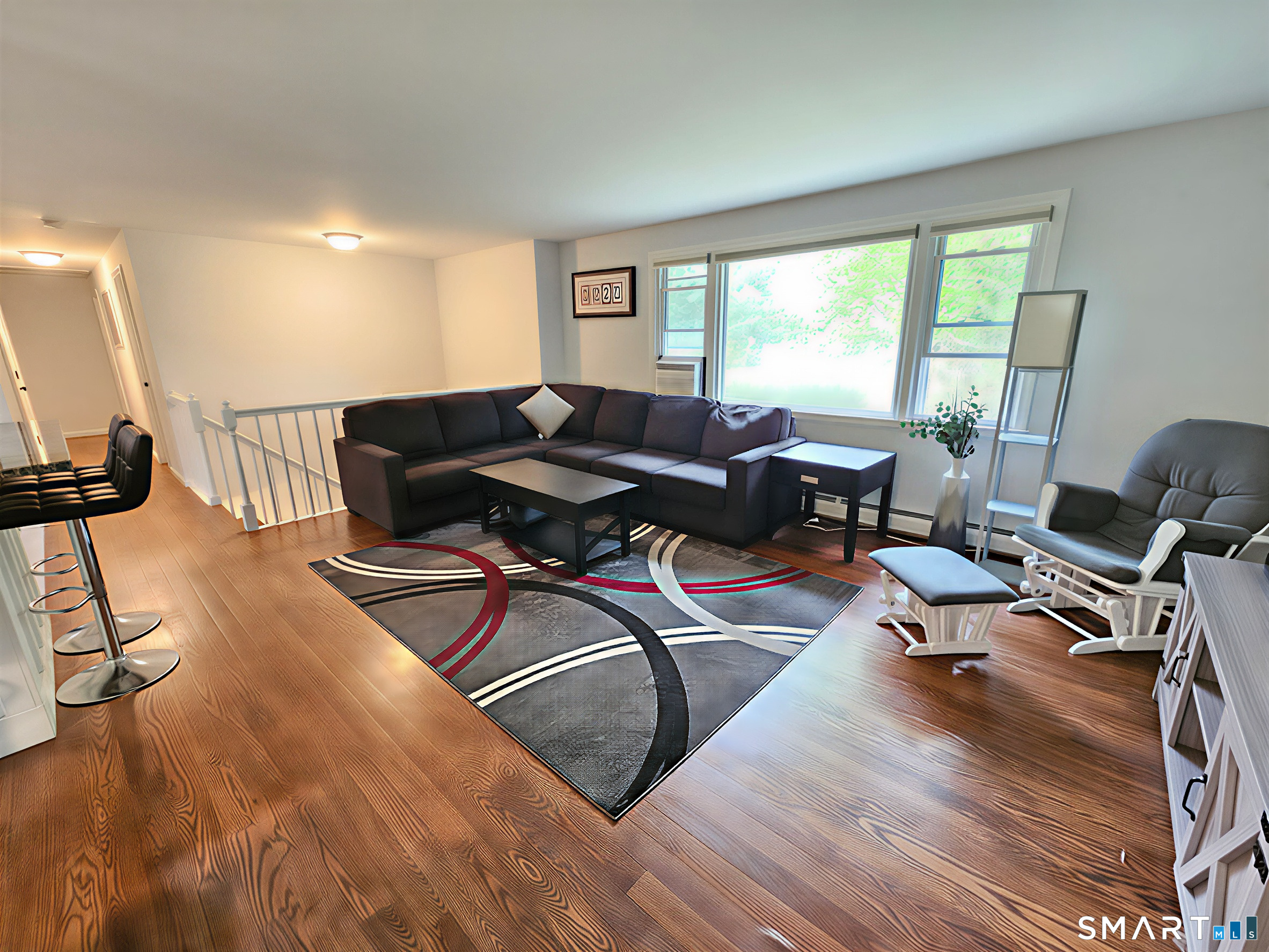63 Pond Road Windsor, CT 06095 - Photo 2 of 17 a living room with furniture window and wooden floor