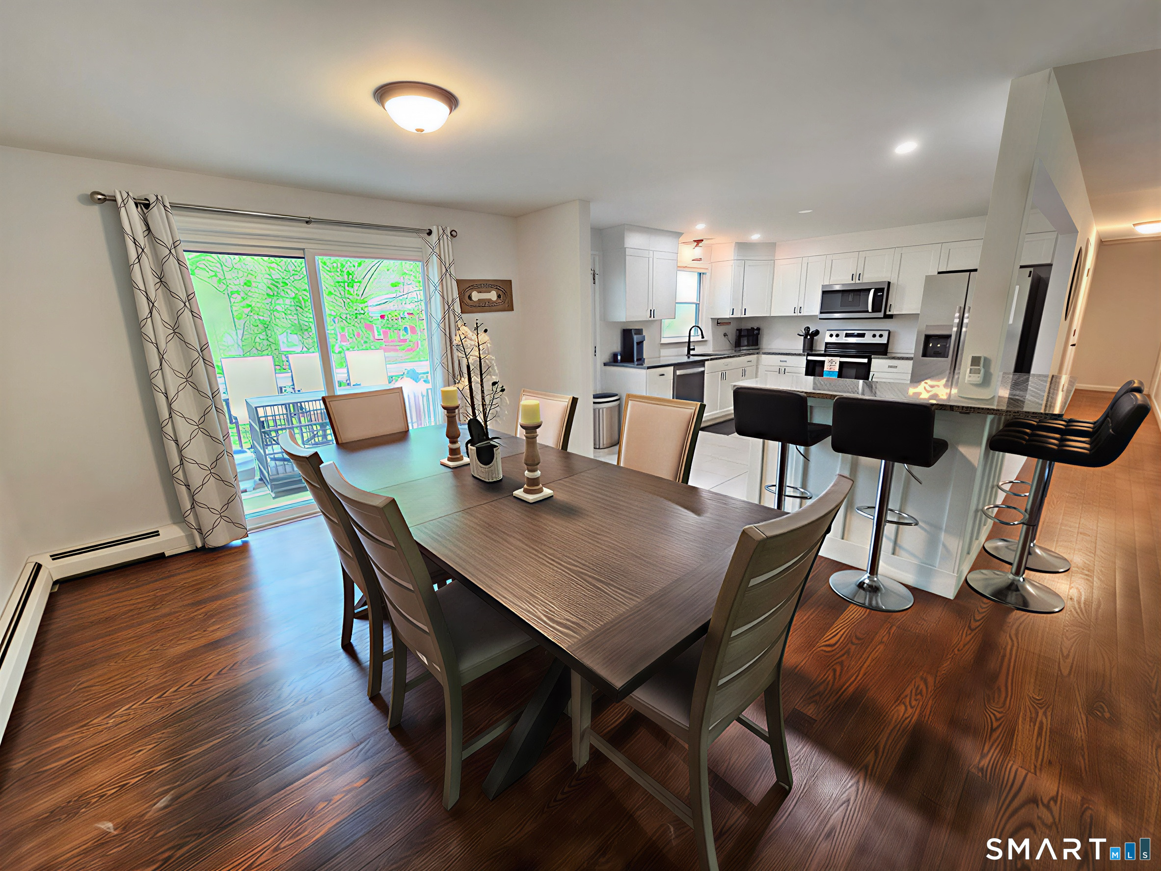 63 Pond Road Windsor, CT 06095 - Photo 5 of 17 a view of a dining room with furniture and wooden floor