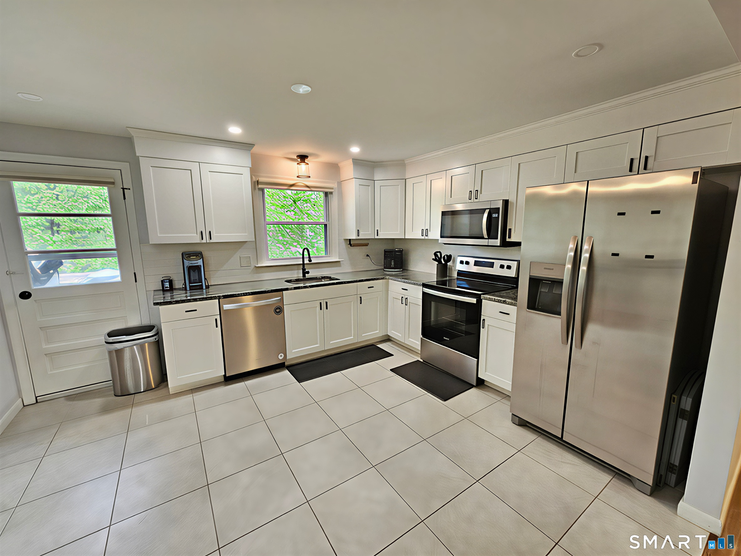 63 Pond Road Windsor, CT 06095 - Photo 7 of 17 a kitchen with granite countertop cabinets and steel stainless steel appliances