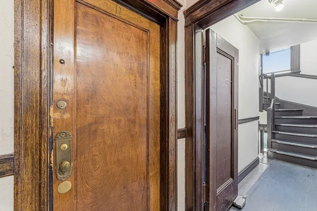 a bathroom with a shower and a glass door
