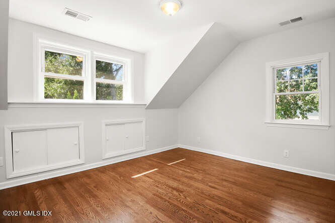 33 Sunshine Avenue Riverside, CT 06878 - Photo 16 of 26 an empty room with wooden floor and windows