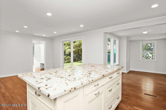 33 Sunshine Avenue Riverside, CT 06878 - Photo 5 of 26 a living room with kitchen island furniture and a table