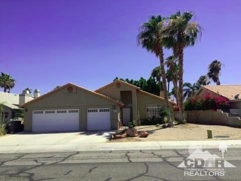 68625 Durango Road Cathedral City, CA 92234 - Photo 1 of 32 a view of a house with a yard and a large tree