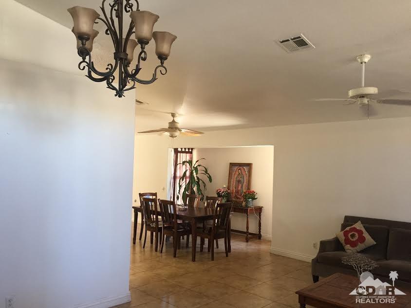 68625 Durango Road Cathedral City, CA 92234 - Photo 14 of 32 a view of a dining room with furniture and chandelier