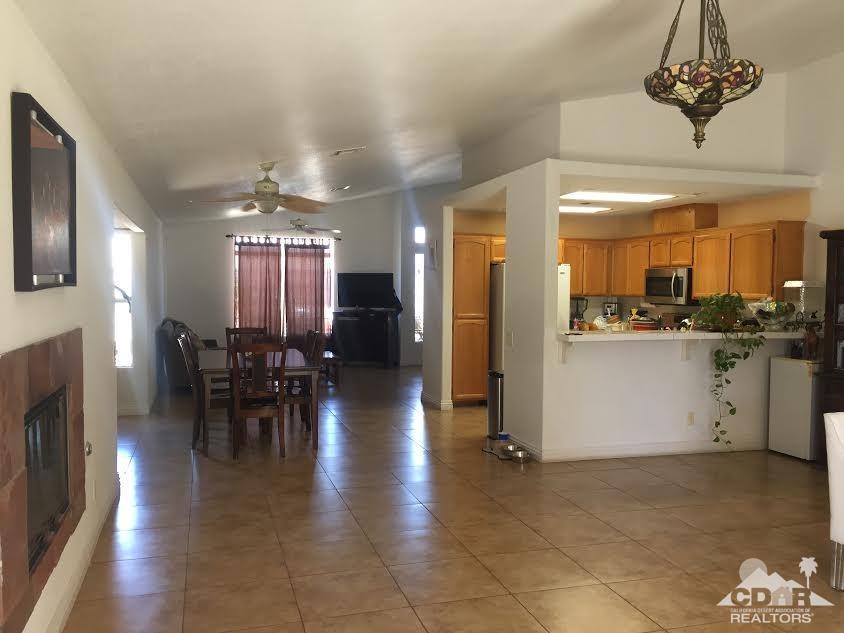 68625 Durango Road Cathedral City, CA 92234 - Photo 5 of 32 a view of a dining room with furniture and chandelier