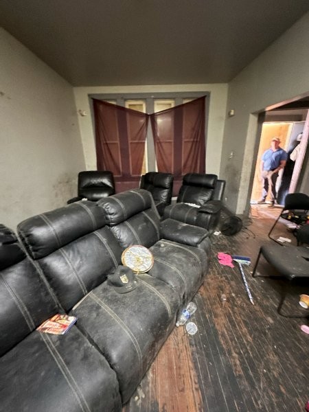 7119 South Emerald Avenue Chicago, IL 60621 - Photo 11 of 50 a living room with furniture and a flat screen tv