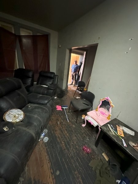 7119 South Emerald Avenue Chicago, IL 60621 - Photo 12 of 50 a living room with furniture and a flat screen tv