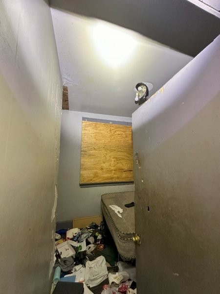 7119 South Emerald Avenue Chicago, IL 60621 - Photo 16 of 50 a bathroom with a sink mirror and toilet