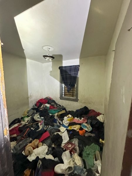 7119 South Emerald Avenue Chicago, IL 60621 - Photo 21 of 50 a bedroom with a bed and a chandelier