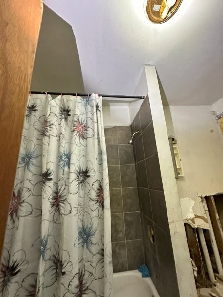 7119 South Emerald Avenue Chicago, IL 60621 - Photo 26 of 50 a bathroom with a sink and a shower