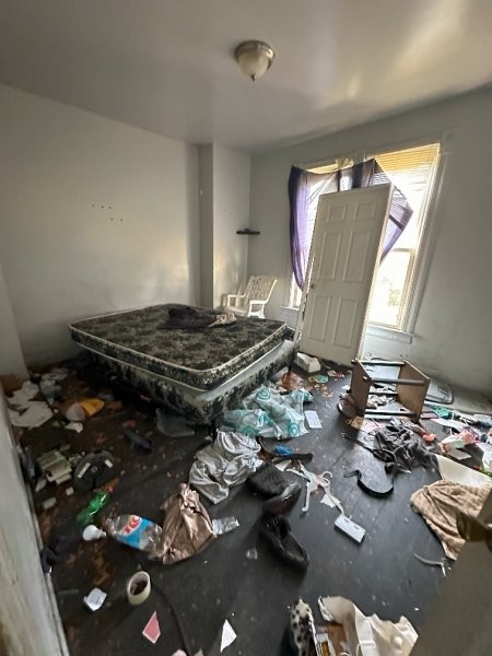 7119 South Emerald Avenue Chicago, IL 60621 - Photo 40 of 50 a room with furniture and wooden floor