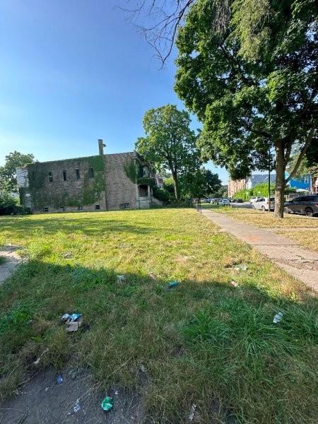 7119 South Emerald Avenue Chicago, IL 60621 - Photo 49 of 50 a view of a swimming pool and trees in the background