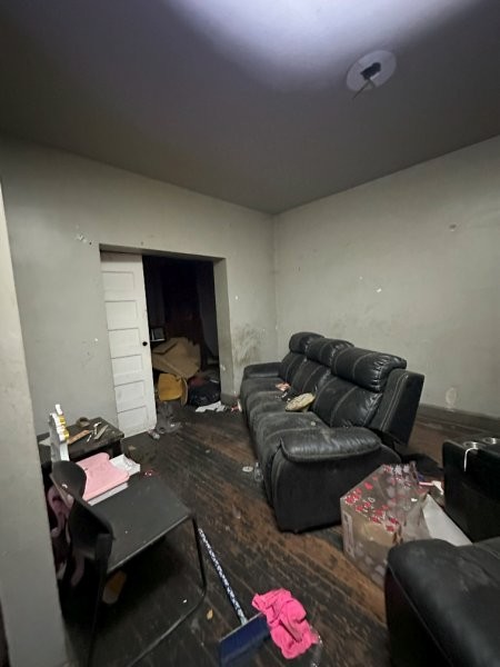 7119 South Emerald Avenue Chicago, IL 60621 - Photo 50 of 50 a living room with furniture and a wooden floor