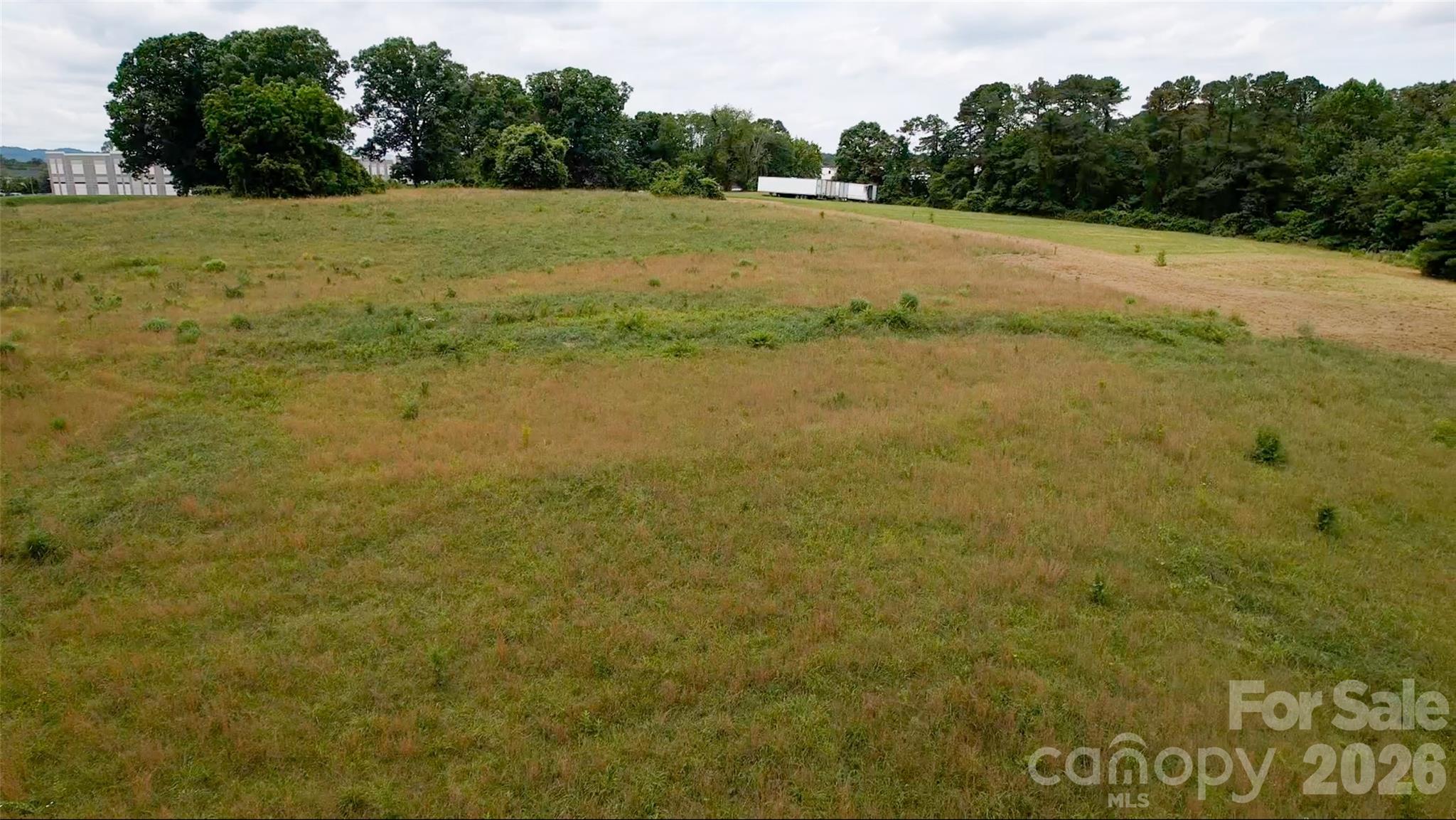 412 McMurray Road Flat Rock, NC 28731 - Photo 10 of 14 a view of a field with an ocean view