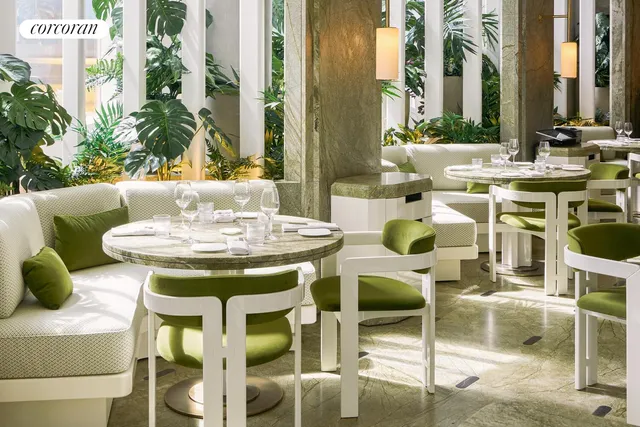 a view of an outside dining space with furniture