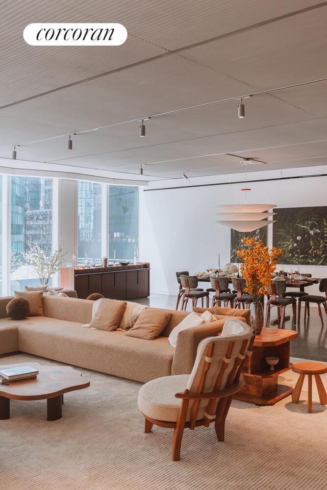 100 East 53rd Street, Unit 9C Manhattan, NY 10022 - Photo 4 of 26 a living room with furniture