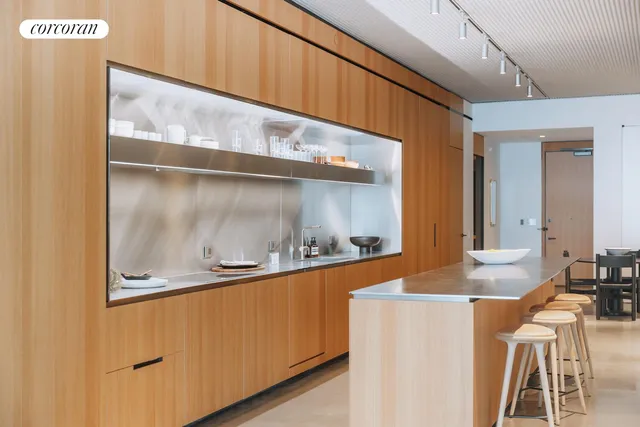 a living room filled with furniture and a large window