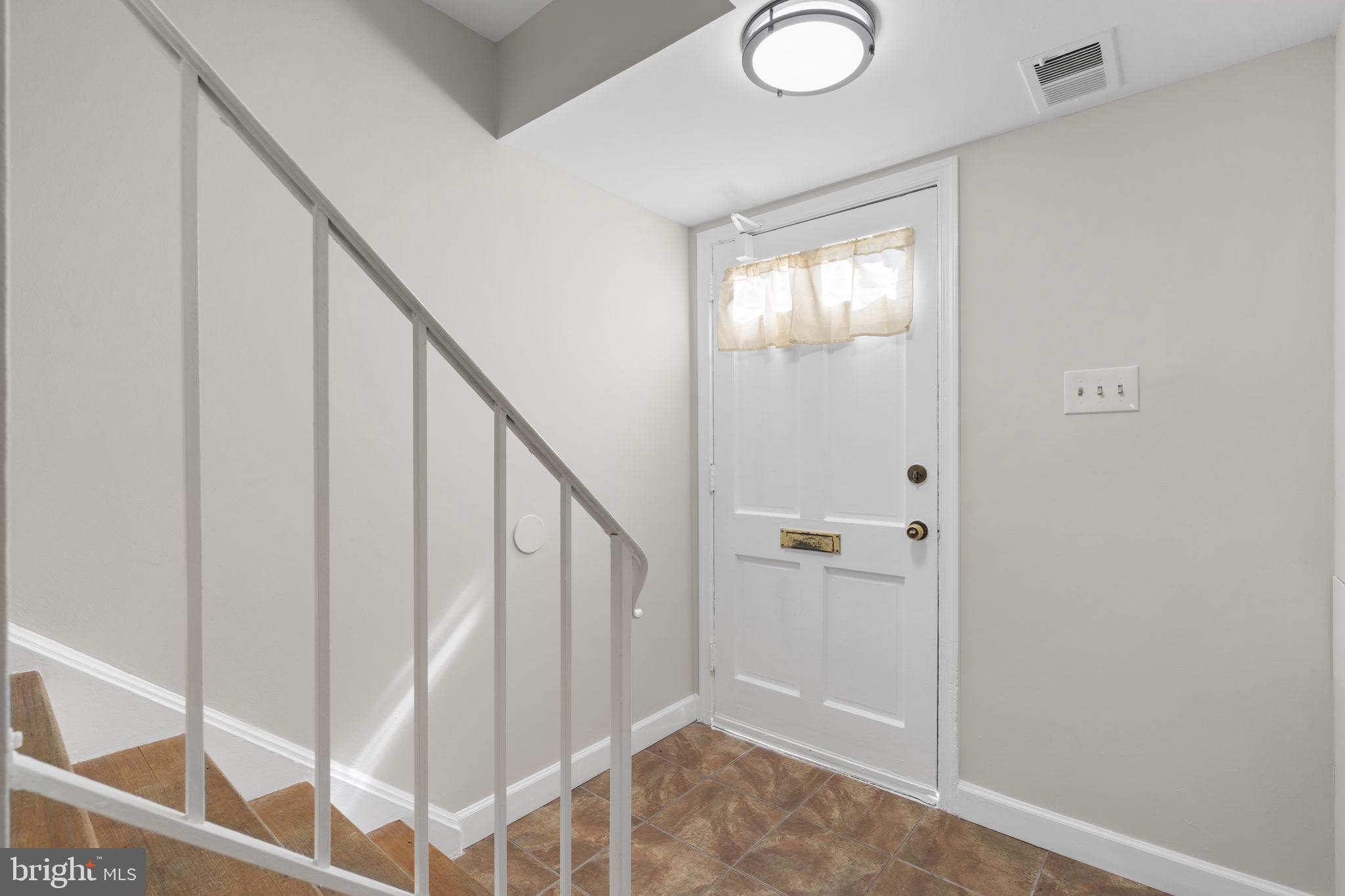 8221 Tory Road, Unit 150 Springfield, VA 22152 - Photo 3 of 36 Welcoming entryway with natural light.