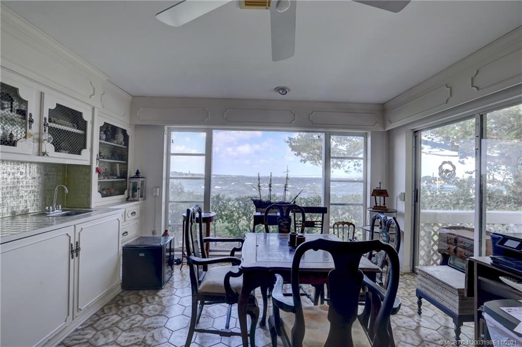2 Timor Street Sewall's Point, FL 34996 - Photo 26 of 58 a view of a dining room with furniture window and outside view