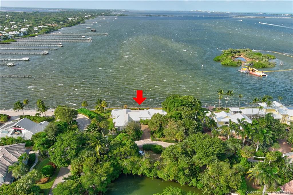2 Timor Street Sewall's Point, FL 34996 - Photo 50 of 58 a view of a lake with a houses