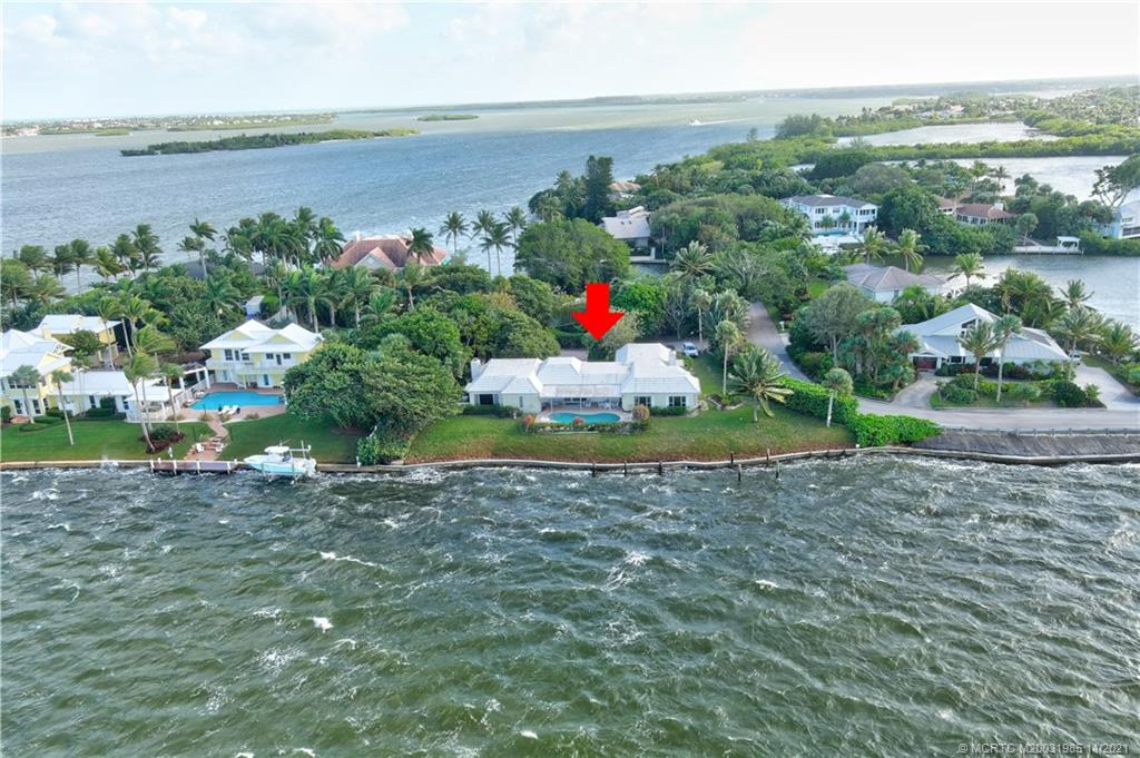 2 Timor Street Sewall's Point, FL 34996 - Photo 54 of 58 a aerial view of a house with a yard and lake view