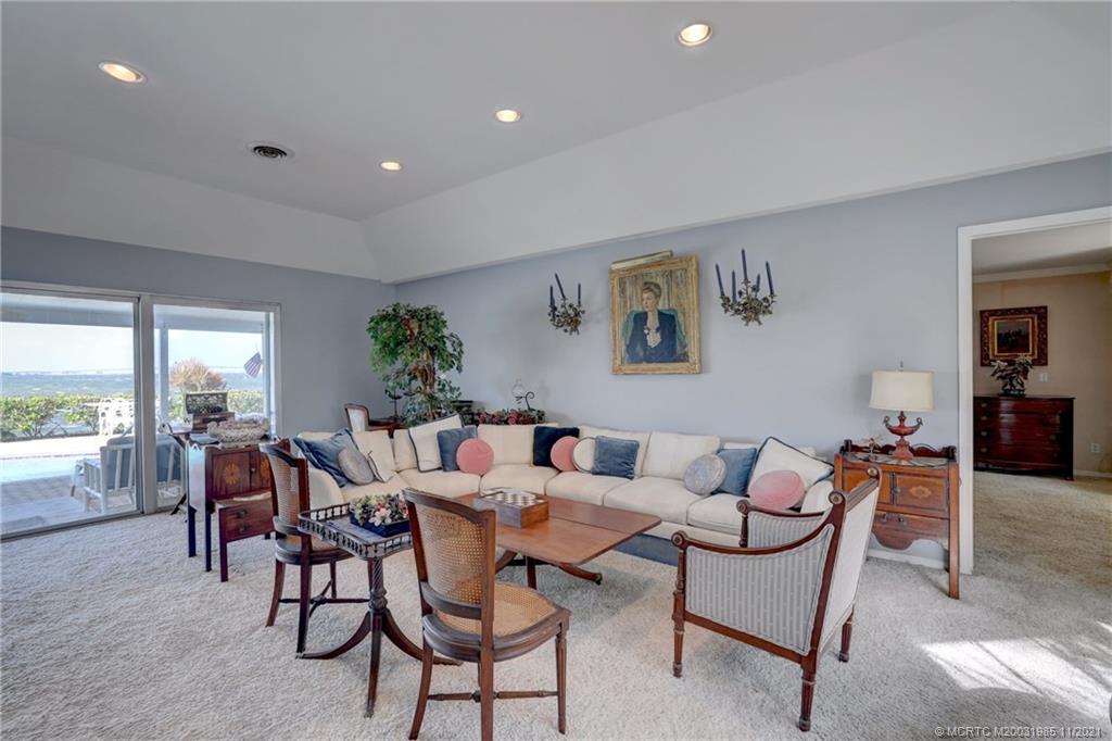 2 Timor Street Sewall's Point, FL 34996 - Photo 8 of 58 a dining room with furniture and large windows