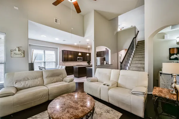 a large kitchen with granite countertop counter space a sink appliances and cabinets