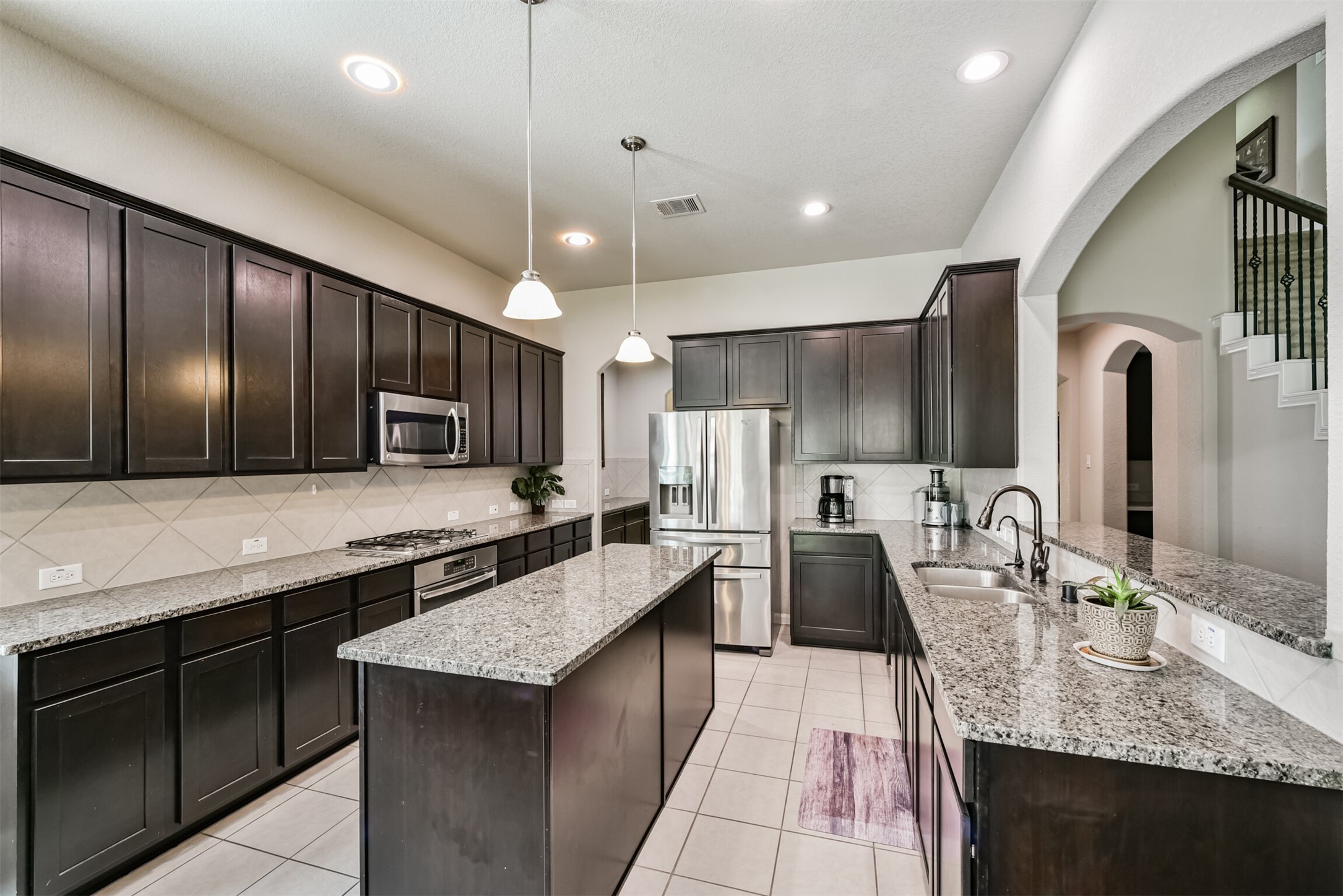 4827 Oak Rambling Drive Katy, TX 77494 - Photo 15 of 45 a large kitchen with a large counter top appliances and cabinets