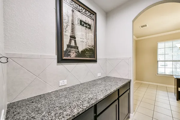 a living room with furniture ceiling fan and a rug