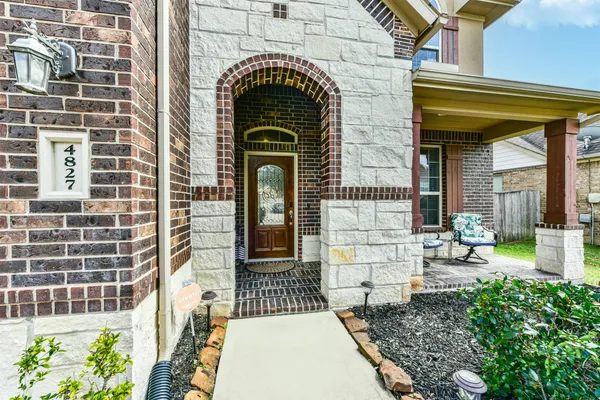 a view of an entryway with a table and chairs