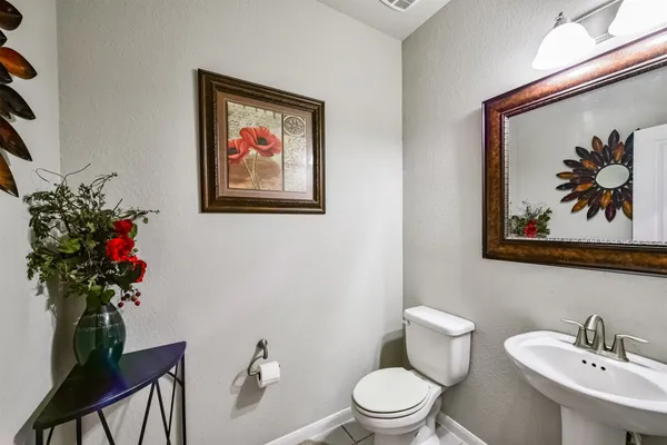 a bedroom with a bed and a ceiling fan