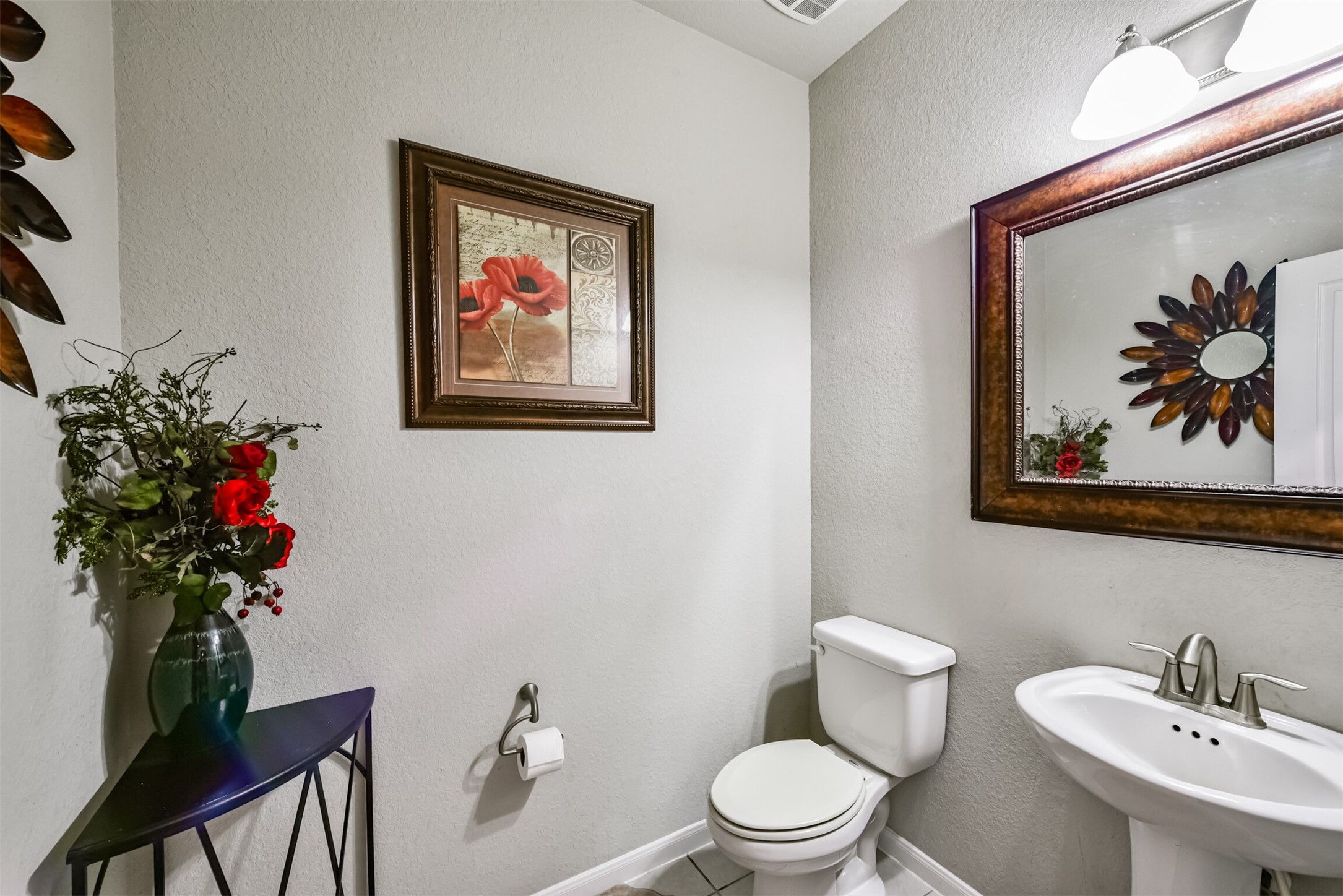 4827 Oak Rambling Drive Katy, TX 77494 - Photo 24 of 45 a bathroom with a toilet a sink and mirror