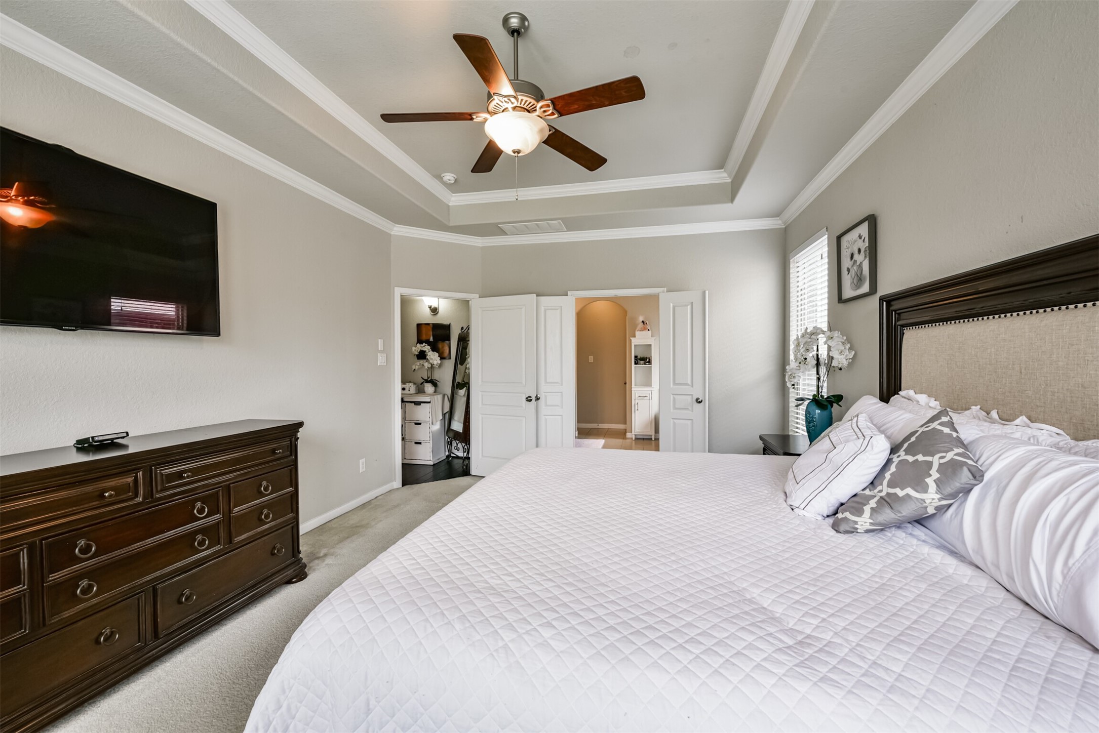 4827 Oak Rambling Drive Katy, TX 77494 - Photo 26 of 45 a bedroom with a bed and a flat screen tv