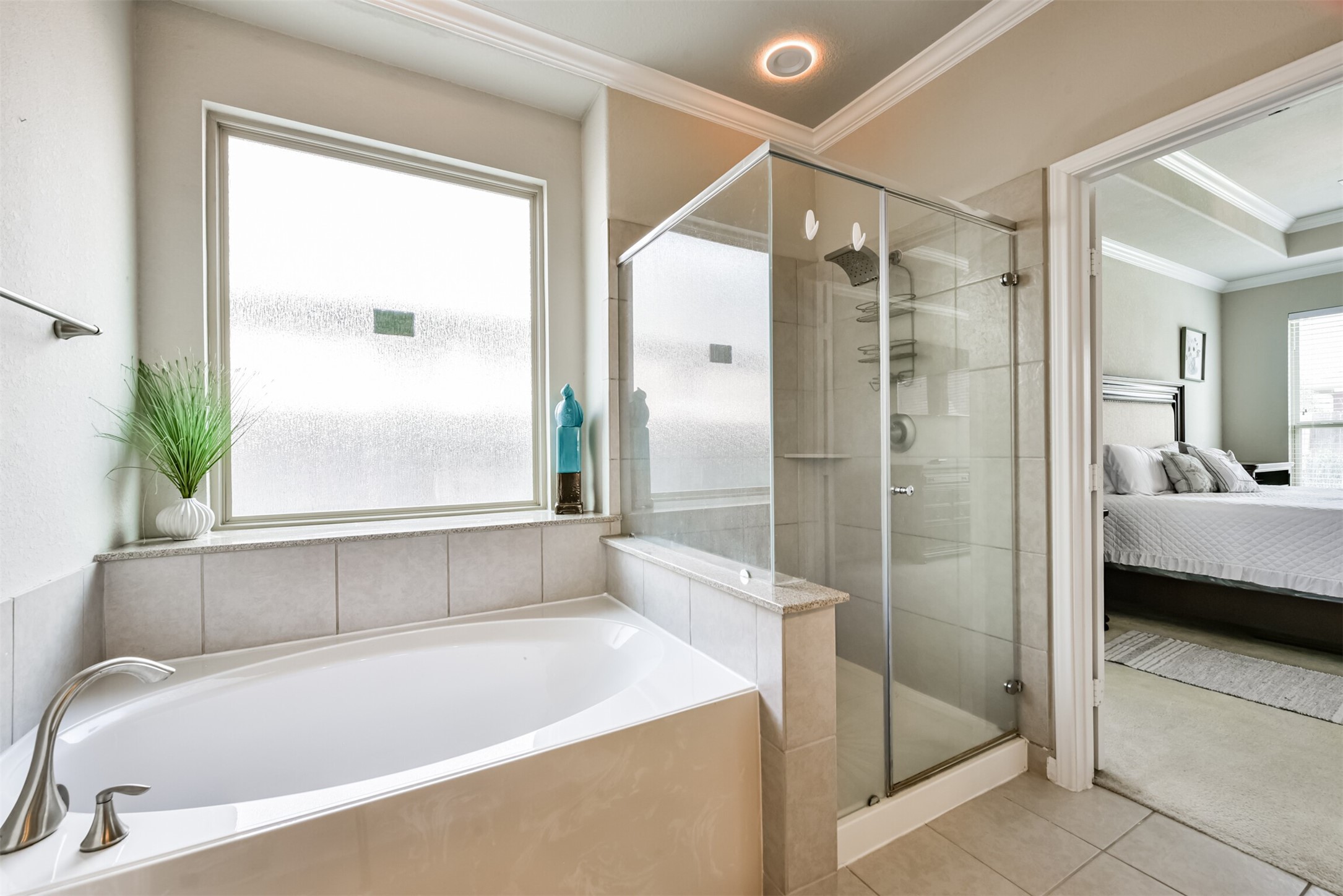 4827 Oak Rambling Drive Katy, TX 77494 - Photo 29 of 45 a bathroom with a tub shower and sink