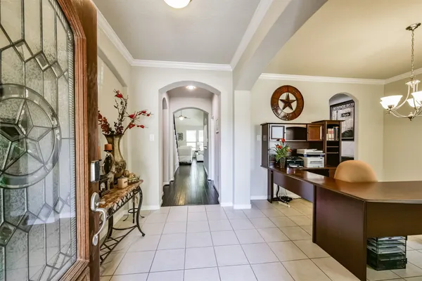 a view of a dining room with furniture and a potted plant